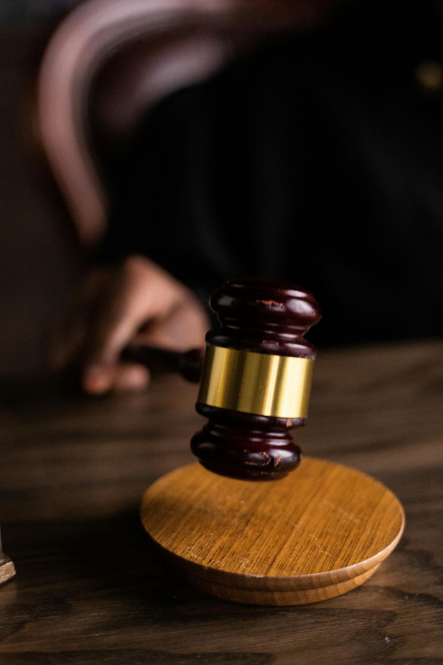 Auctioneer's gavel resting on a wooden block