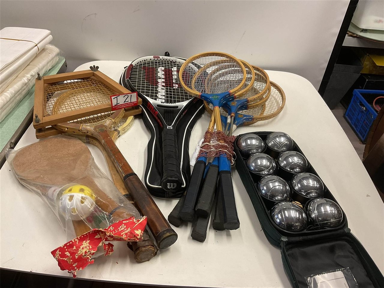 Tennis Racquets X2 Vintage, 1 New, And Shuttlecock Set, 6 Badminton Racquets And A Net And Set Of Boule Balls In A Case