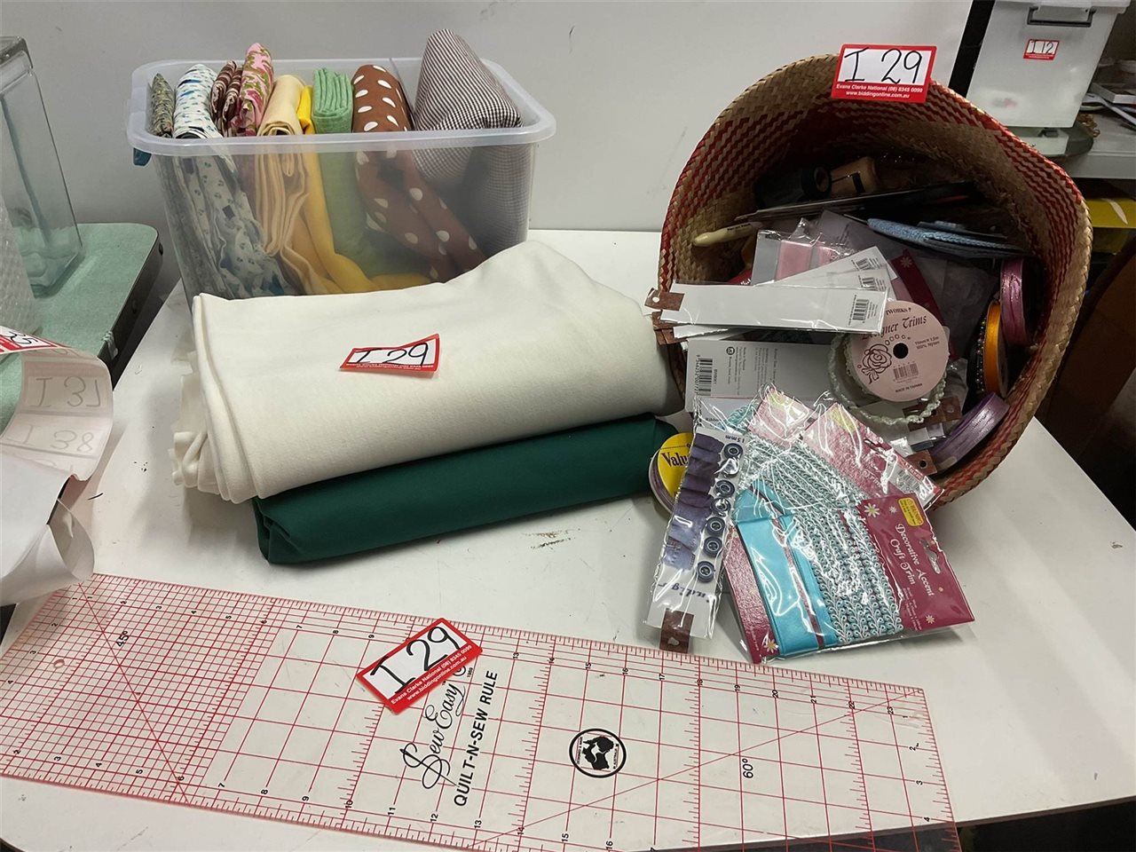 Material Pieces And Assorted Sewing Items In A Basket With Quilt And Sew Ruler