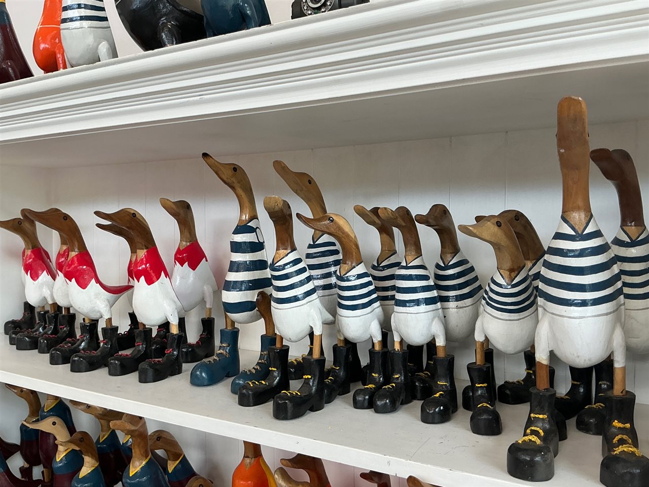 Lot of Approx 18 Carved Timber Ducks, Football Guernsey Colours