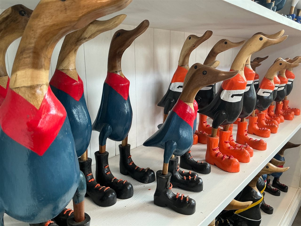 Lot of Approx 18 Carved Timber Ducks, Football Guernsey Colours
