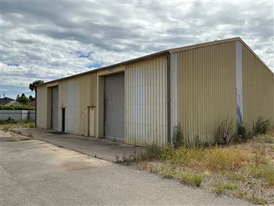 Industrial Shed -15.4 Metre Approx x 12.4 Metre Deep x 6.1 M High to Appex - Divided In 2 Sections (Rooms) with Centre Colourbond Dividing Wall - Frame Is Steel Tube Bolted to Floor - -Shed Has All Walls and Roof Lined with Insulation- with  of 2 Roller Doors ,2 Personal Access Doors - 1 x Internal Door , 3 Whirly Roof Vents - ( Located At Gillman ) Thumbnail